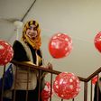 A member from the "Rebirth Generation", a group of Iraqi youths who are trying to revive the embattled city of Mosul, distributes balloons as they organise an event to mark Valentine's Day on February 14, 2017