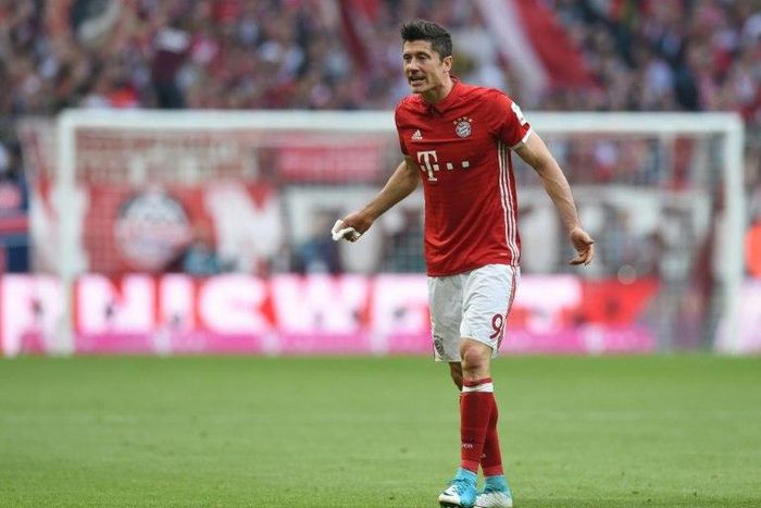 Bayern Munich's Polish striker Robert Lewandowski injured his right shoulder during match against Borussia Dortmund