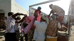 Yemenis recover the bodies of people at a detention centre hit by Saudi-led coalition air strikes in Hodeidah, on October 30, 2016