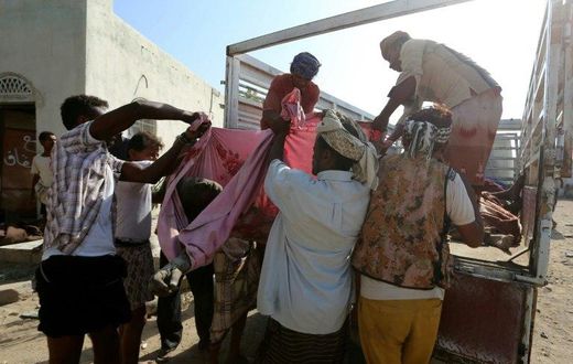 Yemenis recover the bodies of people at a detention centre hit by Saudi-led coalition air strikes in Hodeidah, on October 30, 2016