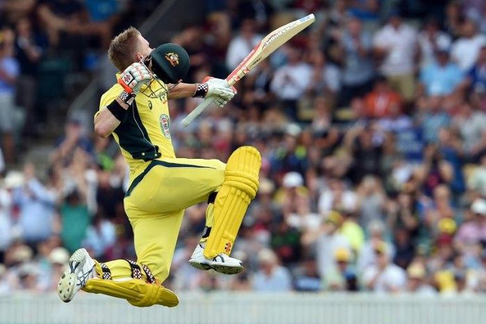 Australia's David Warner celebrates reaching his century against New Zealand in the second one-day international in Canberra on December 6, 2016