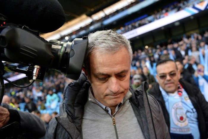 Manchester United's Jose Mourinho gets close to a camera during their match against Manchester City at the Etihad Stadium in Manchester, north west England, on April 27, 2017