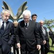 Coordinator of the Jewish communities in Croatia Ognjen Kraus (L) and Croatian rabbi of the Jewish community Luciano Mose Prelevic (R) walk in front of a memorial in the shape of a flower in Jasenovac on April 15, 2016