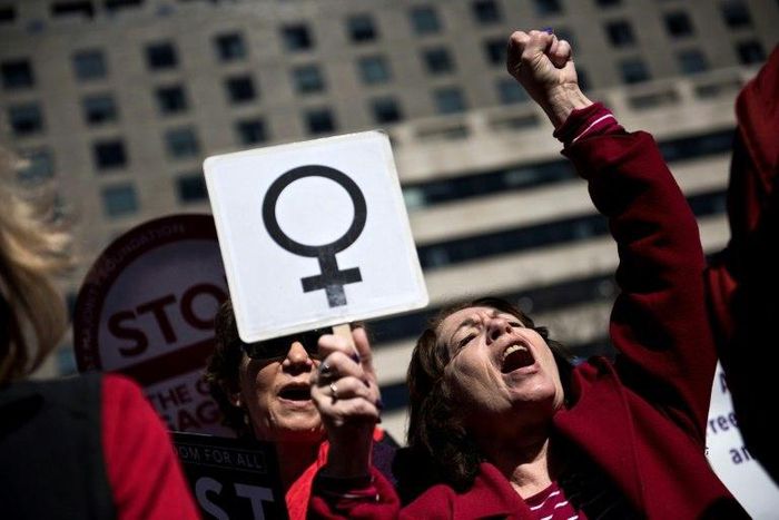 Activists protest the Trump administration and rally for women's rights during a march to honor International Woman's Day on March 8, 2017 in Washington, DC