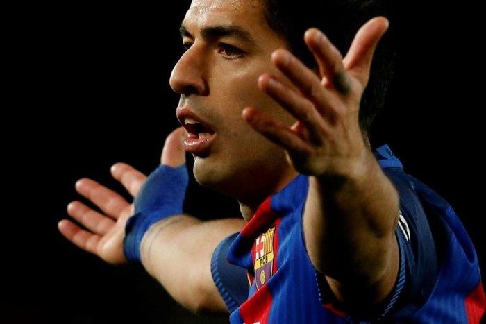 Barcelona's Luis Suarez reacts to a decision of the referee during their Spanish Copa del Rey semi final match against Atletico de Madrid at the Camp Nou stadium in Barcelona on February 7, 2017