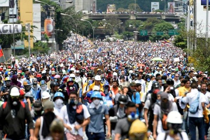 Oppositon activists march along Francisco Fajardo highway, during a protest against President Nicolas Maduro in Caracas, on May 10, 2017