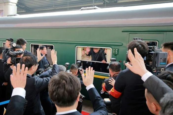 Kim Jong Un (C, pictured during his March 2018 visit to Beijing) has his own special train for his trips to China