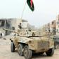 Infantry fighting vehicles belonging to forces loyal to Libya's Government of National Accord take position in Sirte's Al-Giza Al-Bahriya district on November 21, 2016