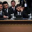 Chief opposition negotiator Mohammad Alloush (C) of the Jaish al-Islam (Army of Islam) rebel group attends the first session of Syria peace talks at Astana's Rixos President Hotel on January 23, 2017