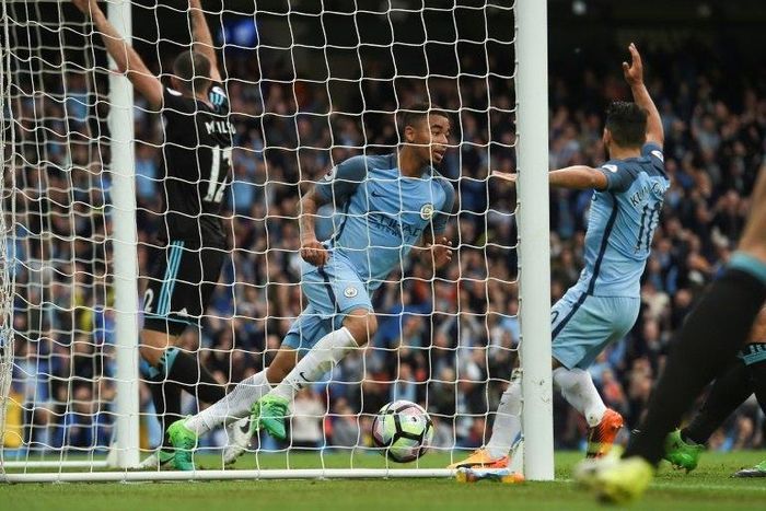Manchester City's striker Gabriel Jesus (C) turns to celebrate after scoring the opening goal during the English Premier League football match against West Bromwich Albion at the Etihad Stadium in Manchester, north west England, on May 16, 2017