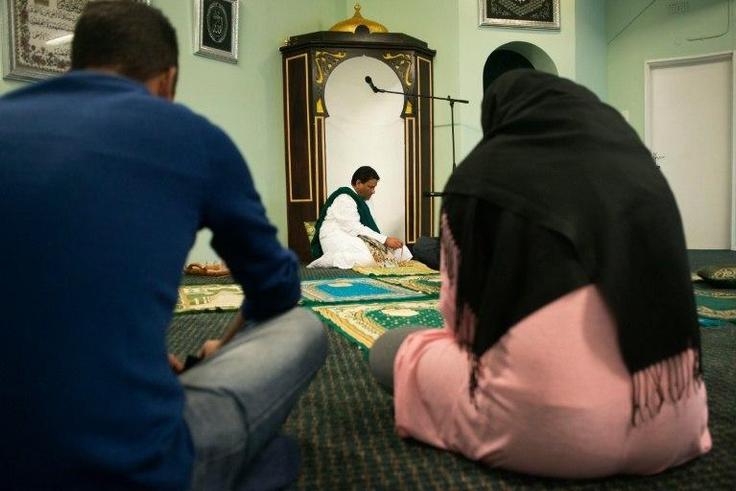 Imam Muhsin Hendricks (C) leads the start of the Jumu'ah prayer at the Inner Circle Mosque, in Wynberg, on September 2, 2016, in Cape Town
