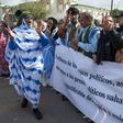 Supporters of the Western Sahara's Polisario Front shout slogans during a demonstration outside the court in Sale on March 13, 2017