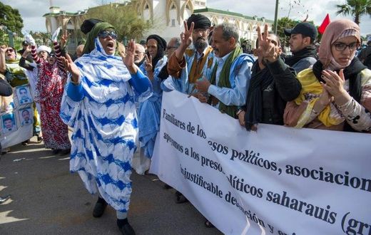 Supporters of the Western Sahara's Polisario Front shout slogans during a demonstration outside the court in Sale on March 13, 2017