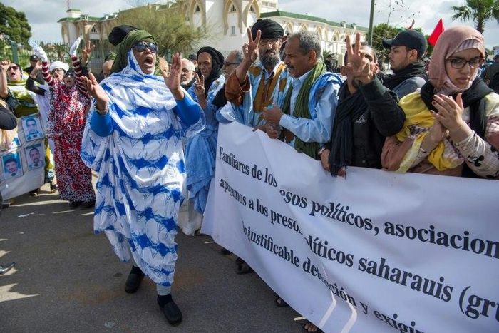 Supporters of the Western Sahara's Polisario Front shout slogans during a demonstration outside the court in Sale on March 13, 2017