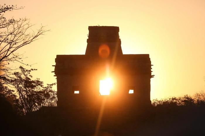 Rays of the sun pass through the Temple of the Seven Dolls in Yucatan, Mexico