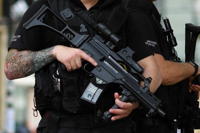 Armed police secure a street in central Manchester, on May 24, 2017