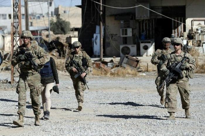 US soldiers patrol near an Iraqi army base on the outskirts of Mosul, on November 23, 2016