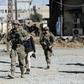 US soldiers patrol near an Iraqi army base on the outskirts of Mosul, on November 23, 2016