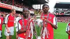 Lauren (left) and Kanu lift the English Premiership Trophy. Arsenal trained-coaching staff will be joined by Lauren as they help talent identification skills among Kenyan coaches as the country targets participation in the World Cup 2022 to be held in ...