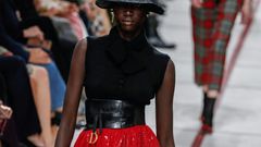 Get ahead... A model wears a bucket hat and leather cumberband at the Dior's tartan-heavy Paris autumn winter show