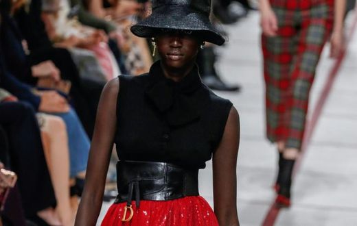 Get ahead... A model wears a bucket hat and leather cumberband at the Dior's tartan-heavy Paris autumn winter show
