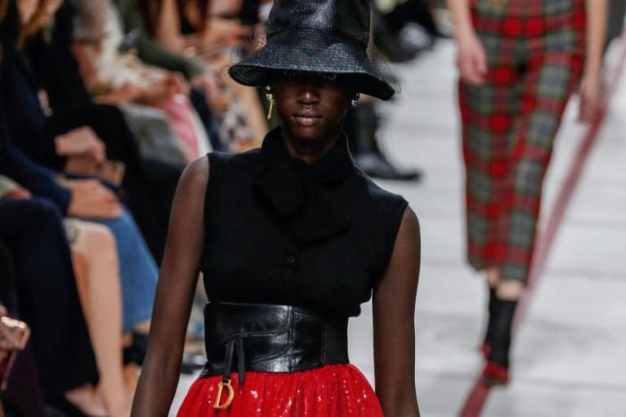 Get ahead... A model wears a bucket hat and leather cumberband at the Dior's tartan-heavy Paris autumn winter show