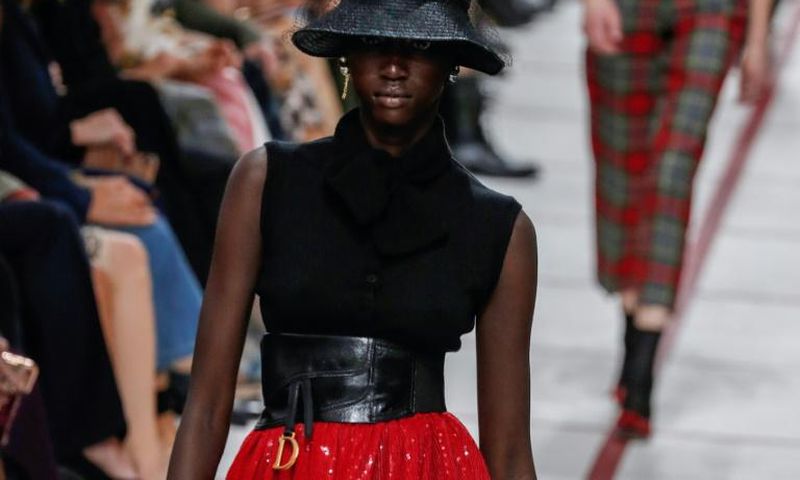 Get ahead... A model wears a bucket hat and leather cumberband at the Dior's tartan-heavy Paris autumn winter show