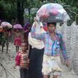 Bangladeshi villagers evacuate to cyclone shelters in Cox's Bazar district on May 30, 2017