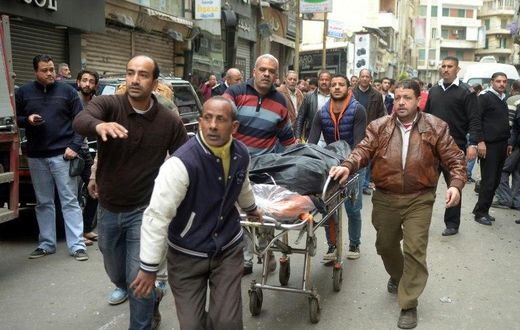 A body is wheeled away near a church in Alexandria, Egypt after a bomb blast struck worshippers gathering to celebrate Palm Sunday on April 9, 2017