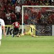 Muangthong United supporters watch intently as Chanathip Songkrasin of Muangthong United (C) rounds Brisbane Roar's goalkeeper Jamie Young to score a goal during their AFC Asian Champions League match, at the SCG Stadium in Bangkok, on April 26, 2017