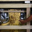 The chariot of the ancient Egyptian boy-king Tutankhamun is revealed after being delivered to its new home, the Grand Egyptian Museum, on May 23, 2017