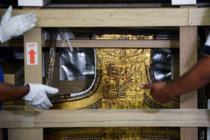 The chariot of the ancient Egyptian boy-king Tutankhamun is revealed after being delivered to its new home, the Grand Egyptian Museum, on May 23, 2017