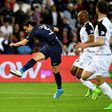 Paris Saint-Germain's Uruguayan forward Edinson Cavani (L) scores his second goal during the French L1 football match between Paris Saint-Germain and Guingamp at the Parc des Princes stadium, in Paris, on April 9, 2017