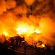 Firefighters battle the fire in Delpan, Tondo, Manila on February 7, 2017