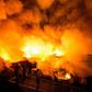 Firefighters battle the fire in Delpan, Tondo, Manila on February 7, 2017