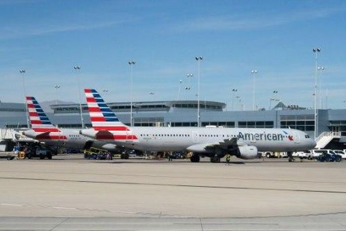 American Airlines said the flight attendant seen shouting in a viral video has been removed from duty while it investigates the incident