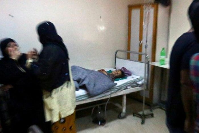 An injured child lies on a bed at a hospital in Syria’s northeastern city of Hassakeh