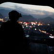 A US Army serviceman sits at the tailgate of an helicopter. The Afghan Taliban announce the start of their "spring offensive", saying they would target foreign forces in their country.