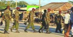 Police officers patrolling a town in Tana River County