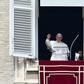 Pope Francis waves to pilgrims gathered in St. Peter's square during his Sunday Angelus prayer on February 12, 2017 at the Vatican