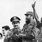 Then Ethiopian President Lieutenant Colonel Mengistu Haile Mariam (R) makes V sign alongside Fidel Castro (C) and Raul Castro (L) during an official visit to Havana, Cuba, on April 15, 1975