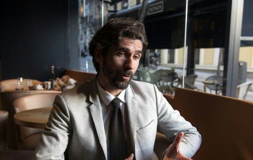 Former Sevilla French football player Julien Escude gestures during an AFP interview in Madrid on February 13, 2016