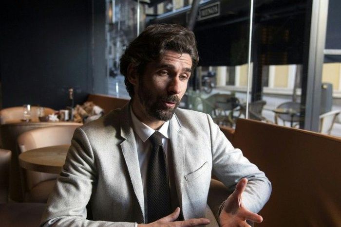 Former Sevilla French football player Julien Escude gestures during an AFP interview in Madrid on February 13, 2016