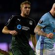Celta Vigo forward John Guidetti (R) shields the ball from FC Krasnodar midfielder Yuri Gazinski during the Europa League round of 16 first leg at the Balaidos stadium in Vigo on March 9, 2017