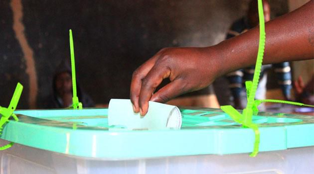 A person casting their ballot