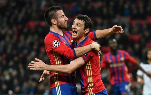 CSKA Moscow's Alan Dzagoev (R) celebrates with teammate Zoran Tosic after scoring a goal during an UEFA Champions League match, in December 2016