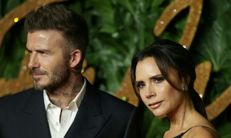 Former English football star David Beckham with wife Victoria