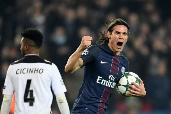 Paris Saint-Germain's Edinson Cavani (R) celebrates after scoring a goal during their UEFA Champions League Group A match against PCF Ludogorets Razgrad, at the Parc des Princes Stadium in Paris, on December 6, 2016