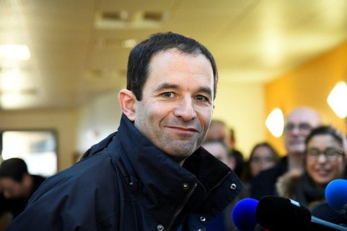 French former minister and candidate for the left-wing primaries, Benoit Hamon, poses at a polling station on January 22, 2017 in Trappes, southwest of Paris