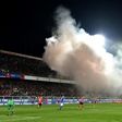 Albania's supporters throw smoke bombs and flares during the FIFA World Cup 2018 qualification football match against Italy March 24, 2017